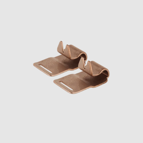 Two bronze-colored metal brackets on a light gray background